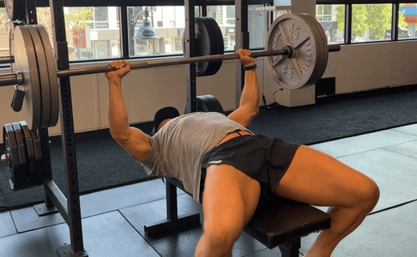 bench pressing 3 plates